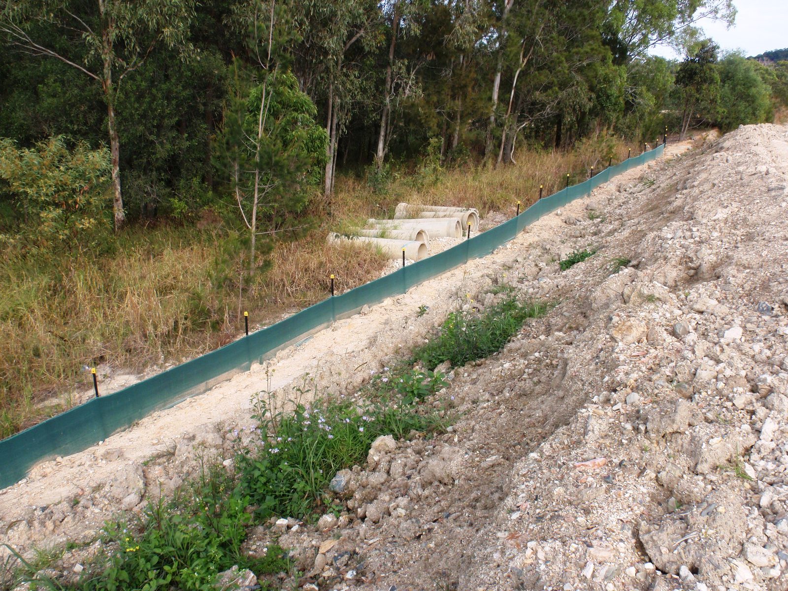 Silt fencing controlling sediment runoff on a construction site - photo 3